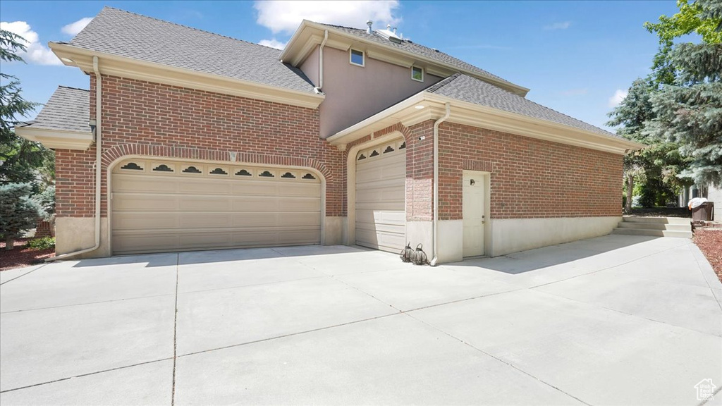 View of front of home featuring a garage