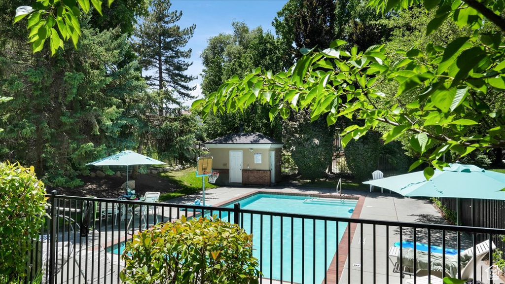 View of swimming pool featuring a patio area