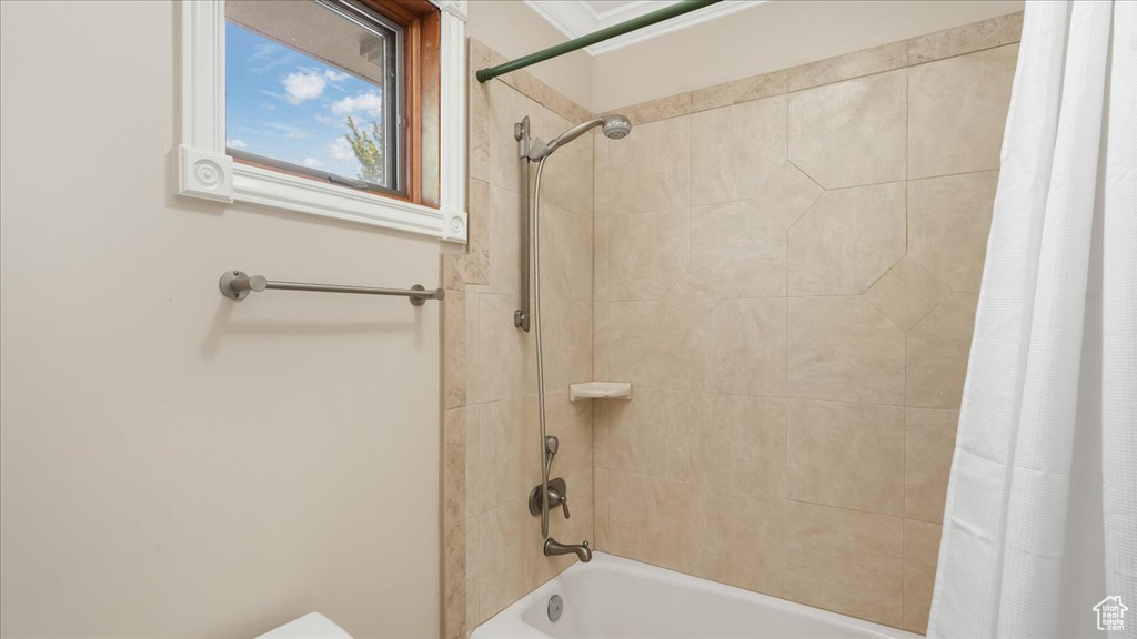 Bathroom featuring shower / bath combo