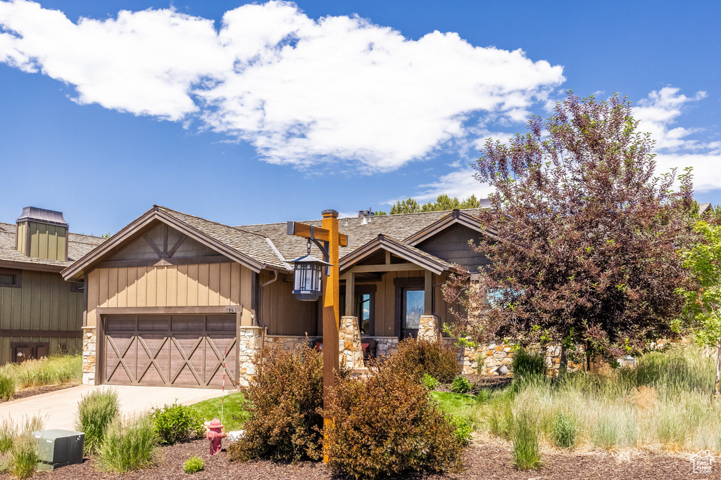 Craftsman-style home featuring a garage