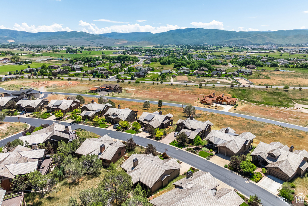 Birds eye view of property with a mountain view