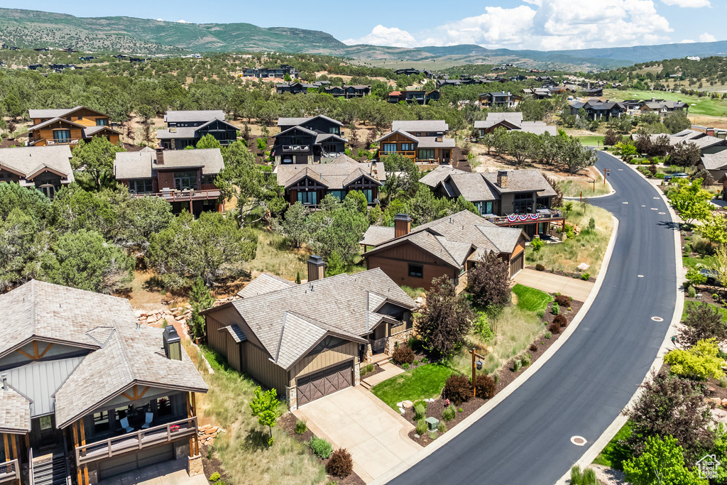 Birds eye view of property with a mountain view