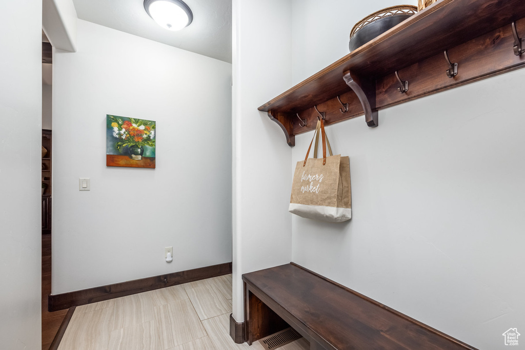 Mudroom featuring tile flooring