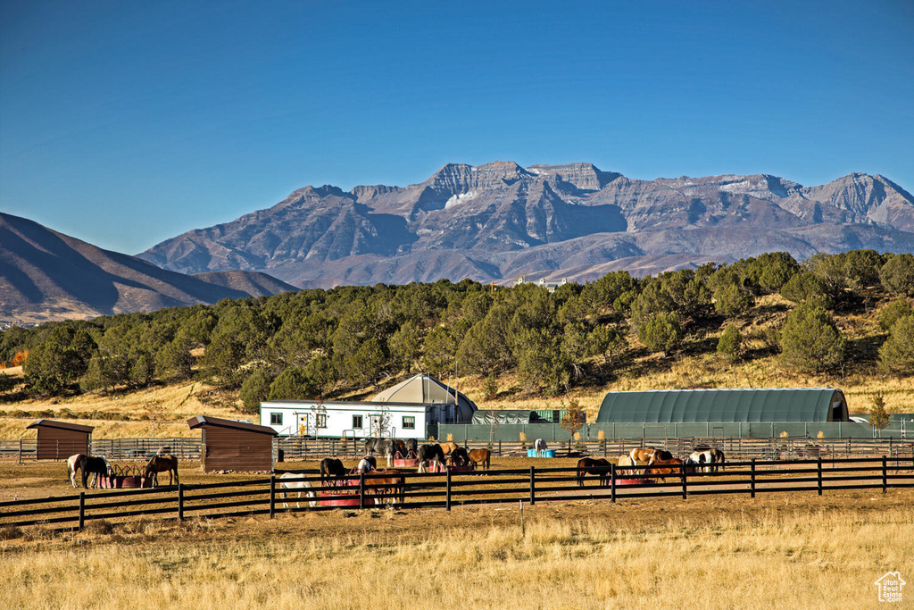 Property view of mountains with a rural view