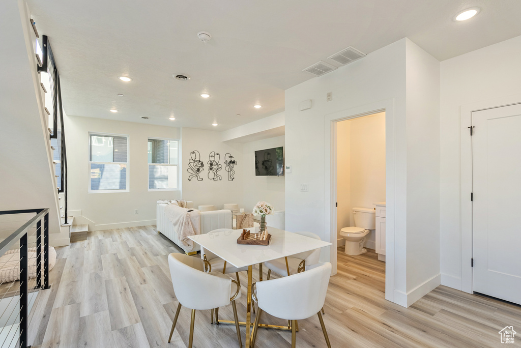 Dining room with light hardwood / wood-style floors