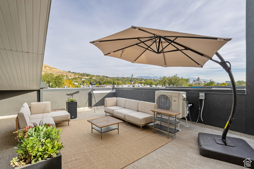 View of patio / terrace with ac unit and an outdoor hangout area