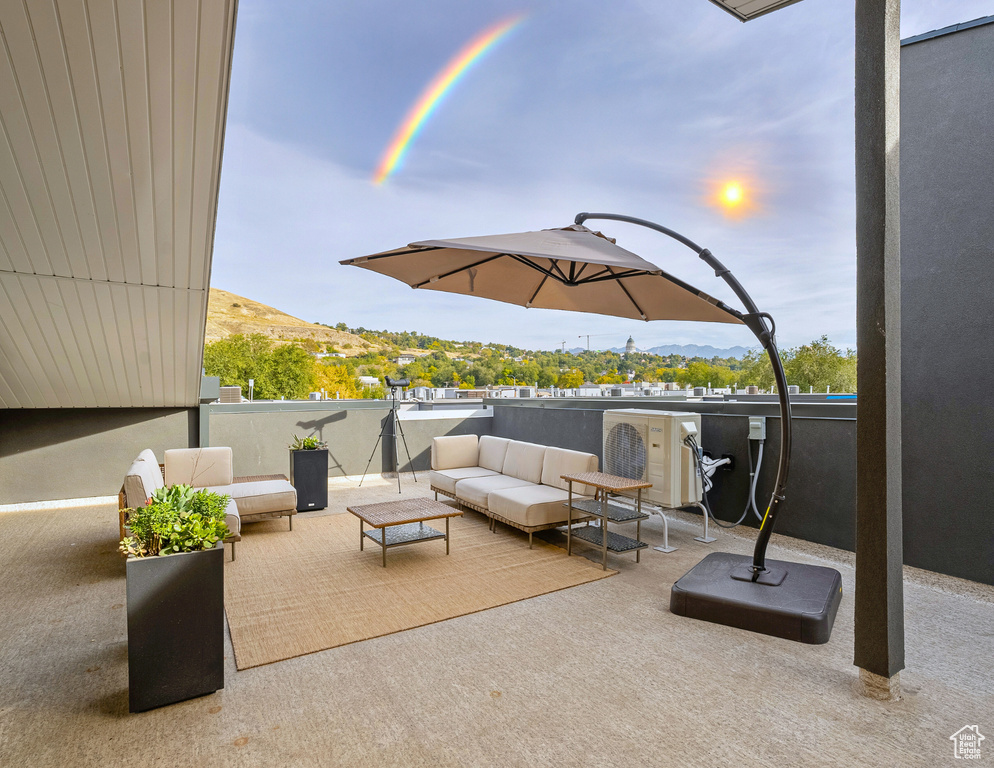 Patio terrace at dusk with a mountain view