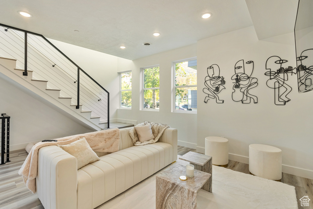 Living room with light hardwood / wood-style flooring