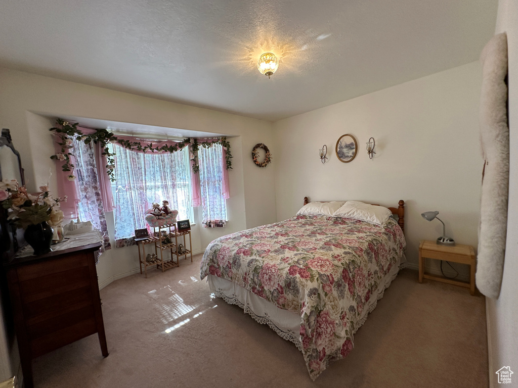 Bedroom featuring carpet flooring