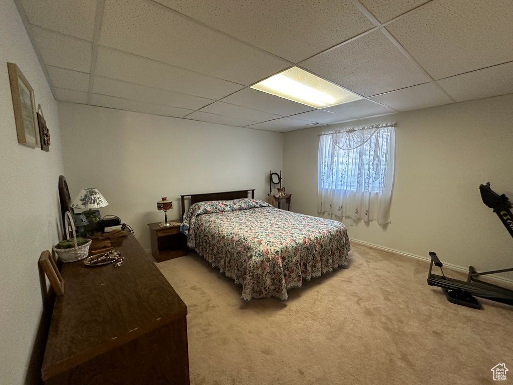 Bedroom with carpet and a drop ceiling