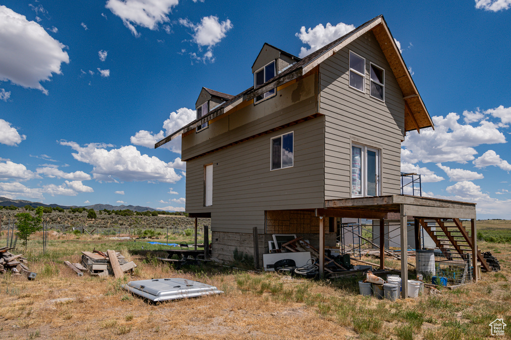 Back of house featuring a deck