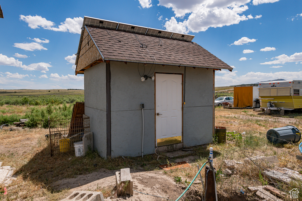 View of shed / structure with a rural view