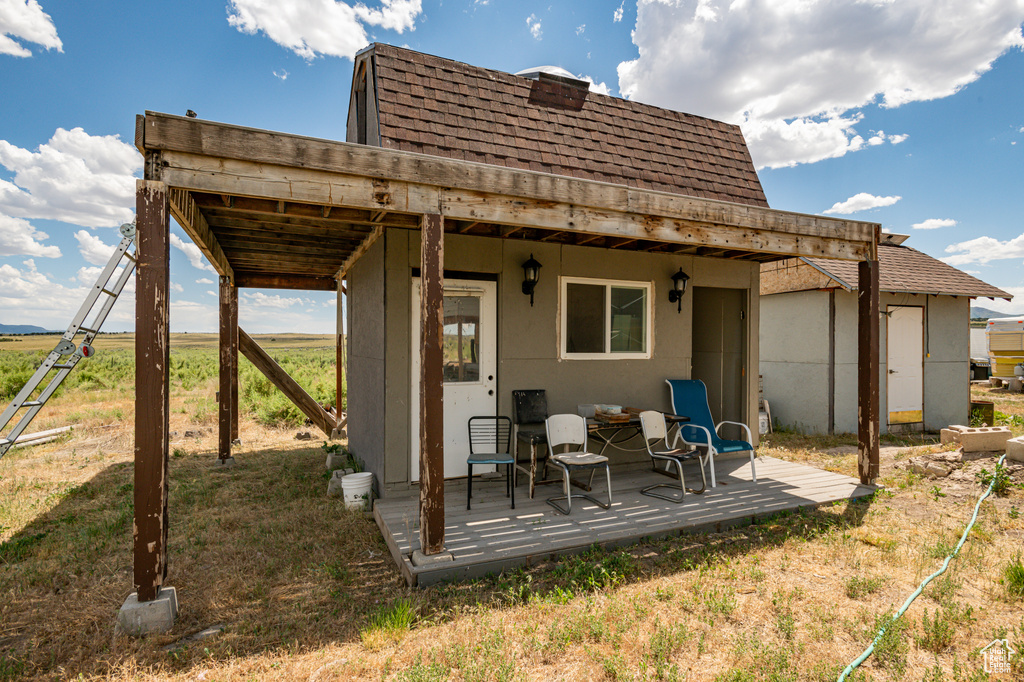 Rear view of house featuring a deck