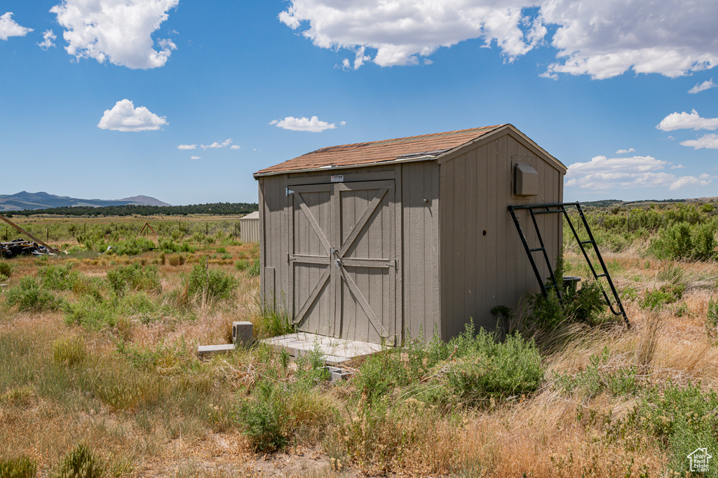 View of outdoor structure featuring a rural view