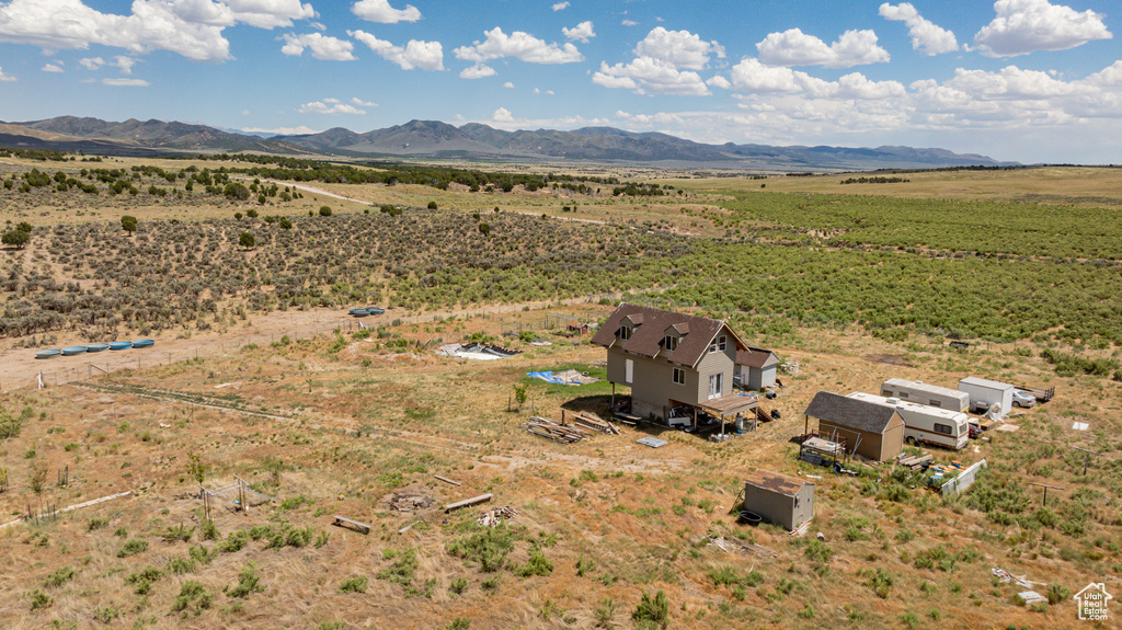 Drone / aerial view with a mountain view and a rural view