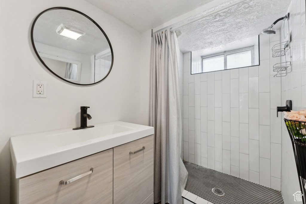 Bathroom with walk in shower and vanity