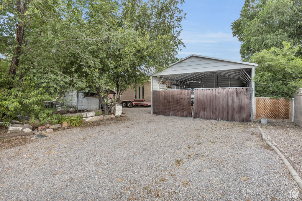 Exterior space featuring a carport