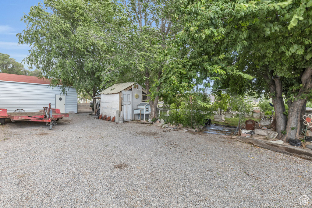 Exterior space featuring a storage unit