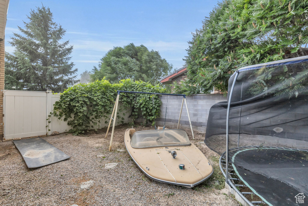 View of yard with a trampoline