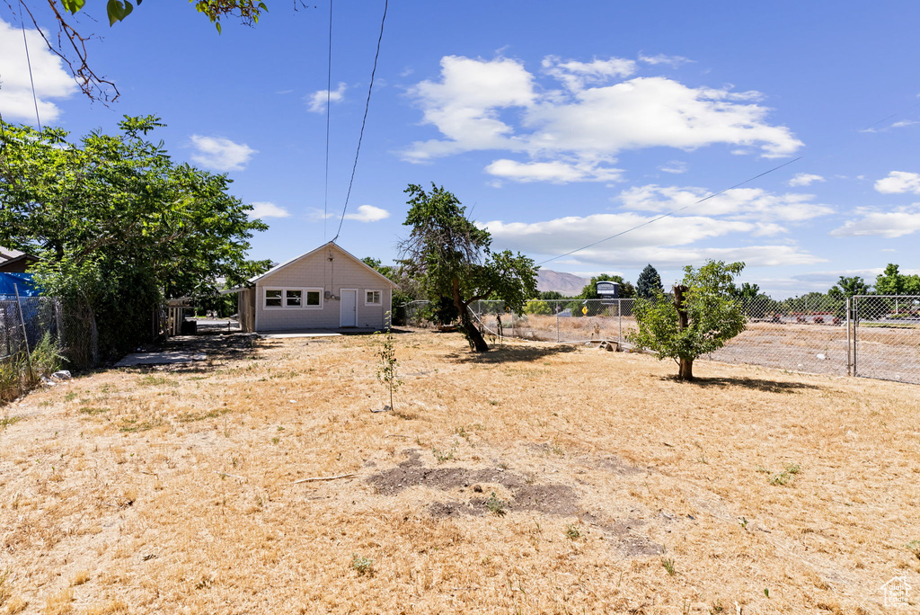 View of yard with a rural view