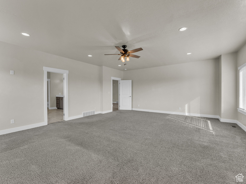 Unfurnished room with visible vents, recessed lighting, carpet floors, and ceiling fan