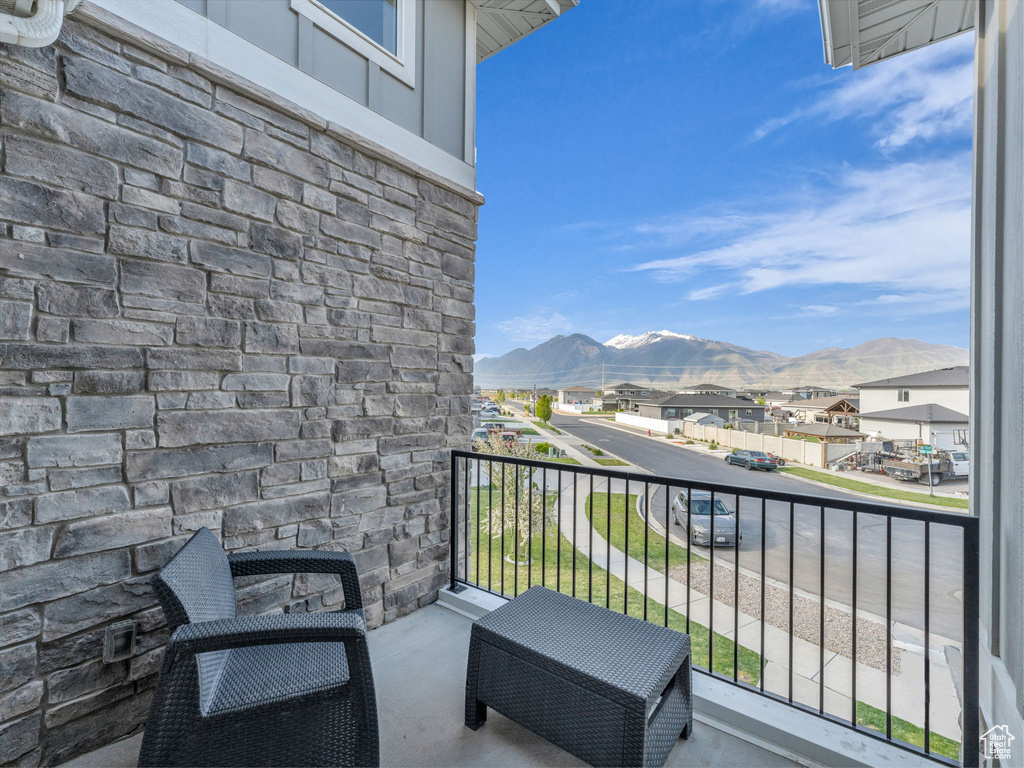 Balcony with a residential view and a mountain view