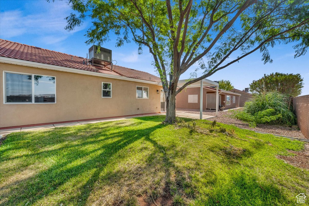 View of yard featuring a patio area and central air condition unit