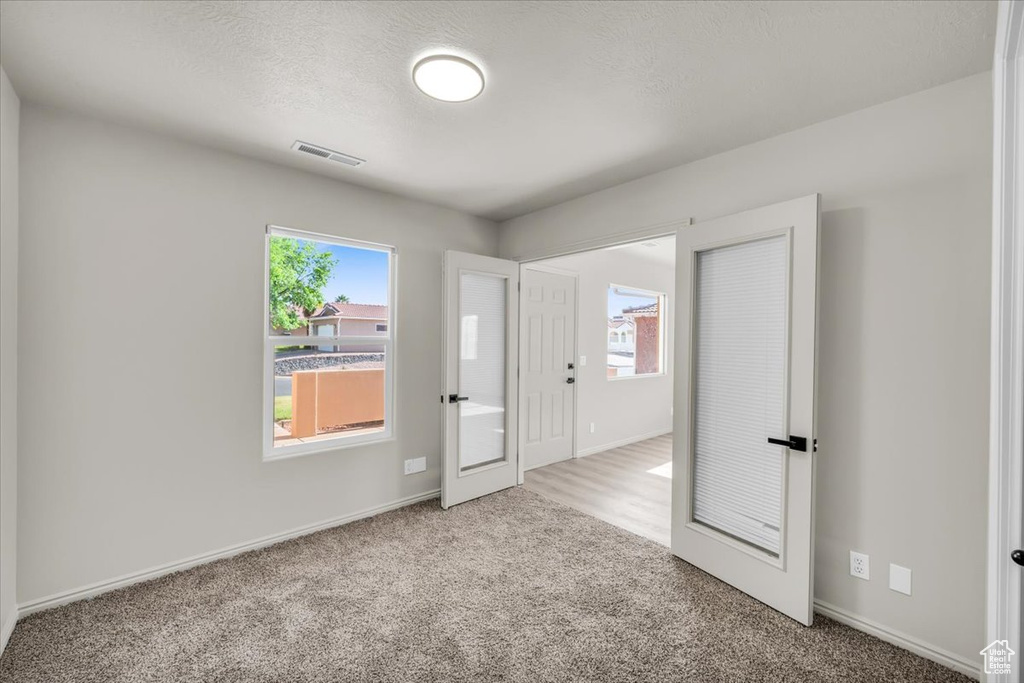 Empty room featuring hardwood / wood-style floors