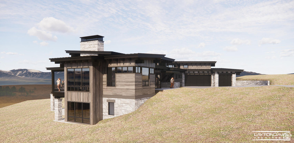 View of side of home featuring a mountain view and a lawn