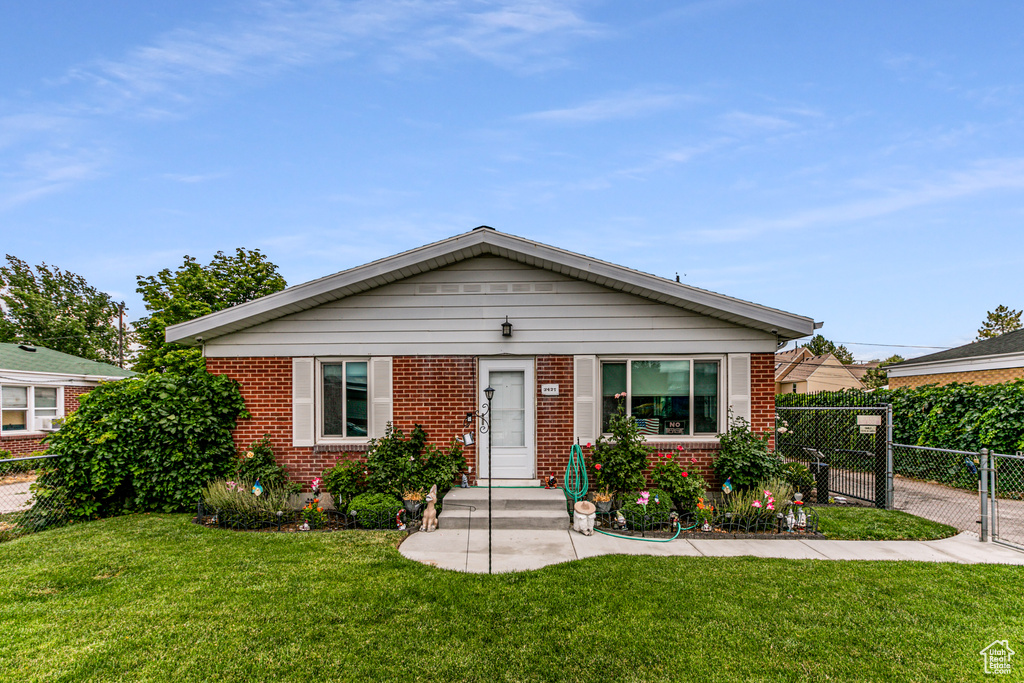 View of front of house with a front lawn