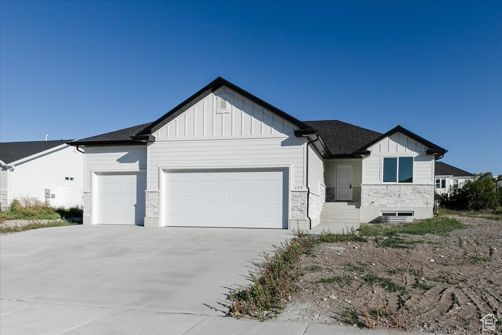 View of front of property featuring a garage