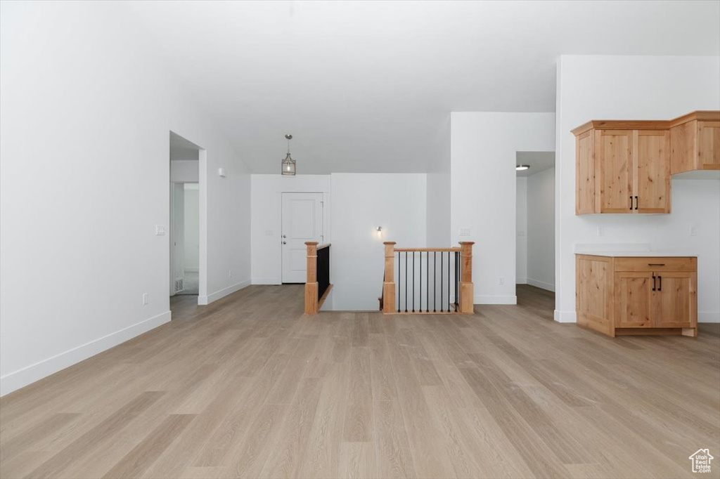 Unfurnished living room with light hardwood / wood-style flooring