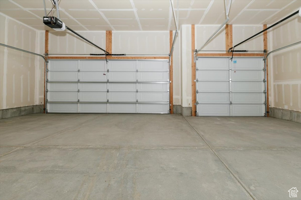 Garage featuring a garage door opener