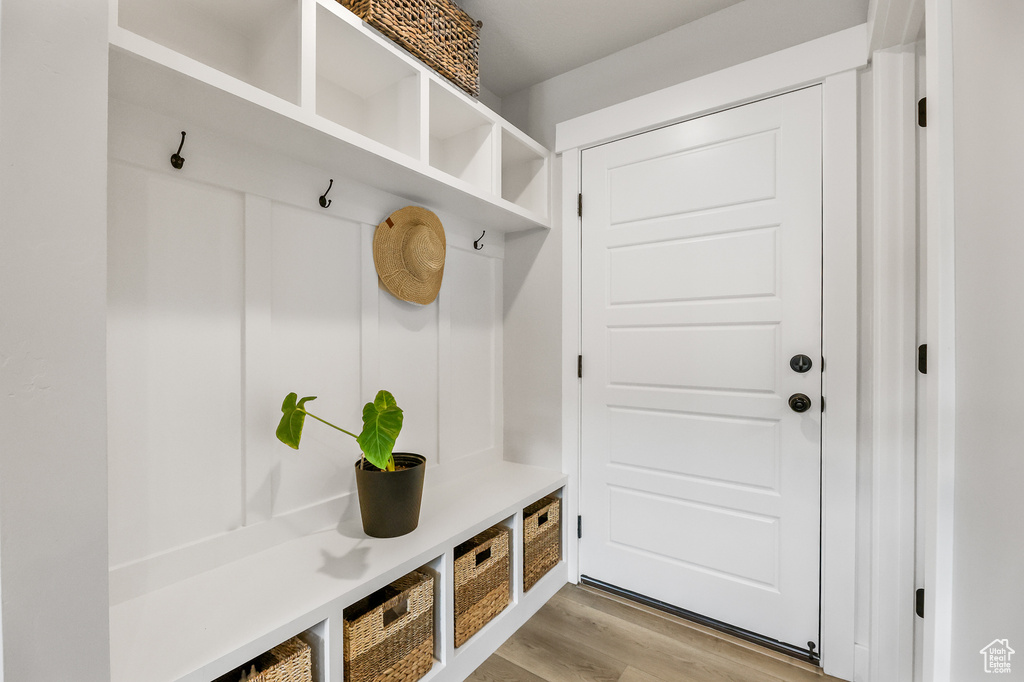 Mudroom with light hardwood / wood-style flooring