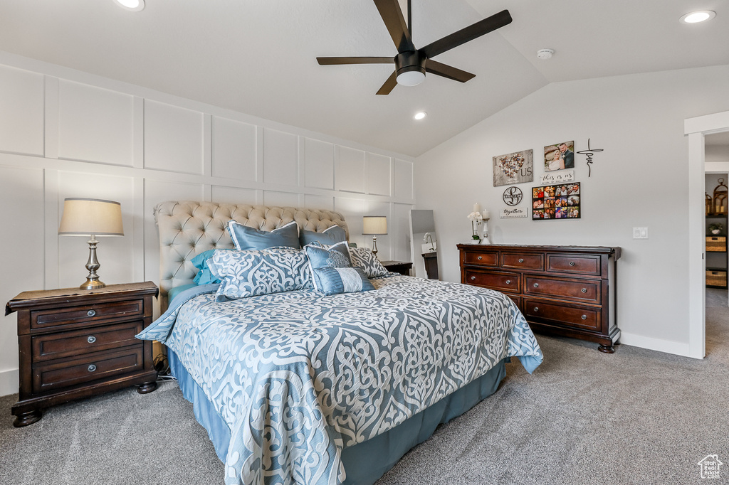 Bedroom with carpet flooring, vaulted ceiling, and ceiling fan