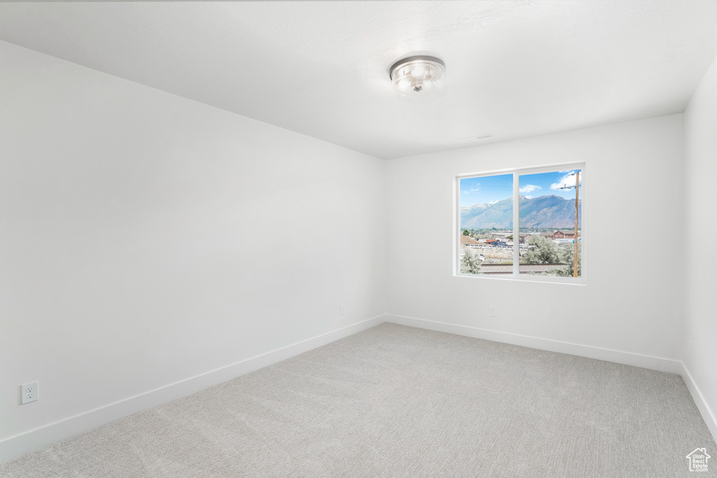 Empty room featuring carpet floors