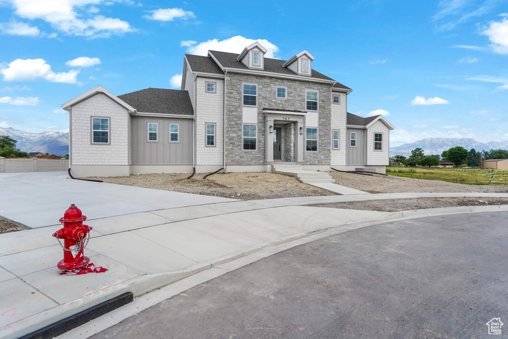 View of front of house with a mountain view