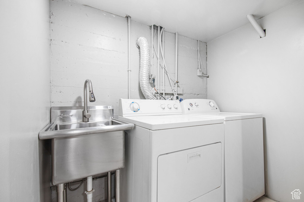 Laundry room with washer and dryer and sink