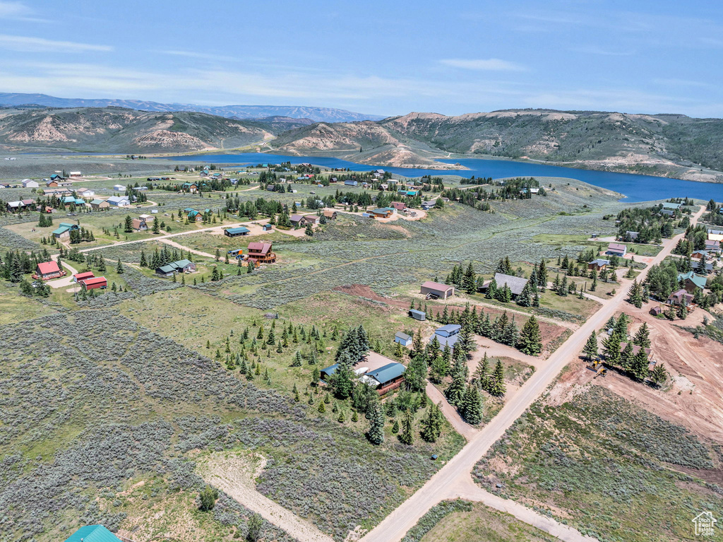 Aerial view featuring a water and mountain view