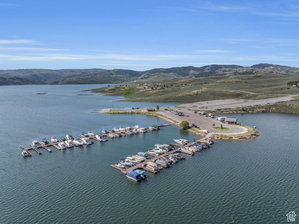 Birds eye view of property featuring a water and mountain view