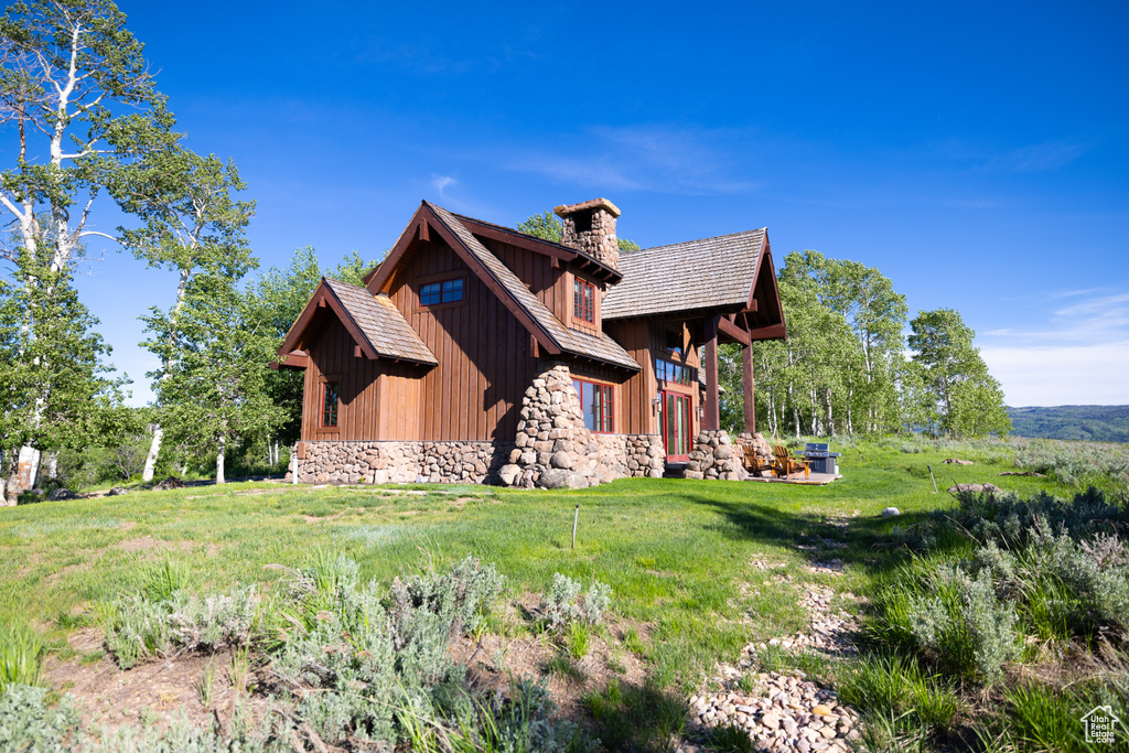 View of home's exterior featuring a lawn