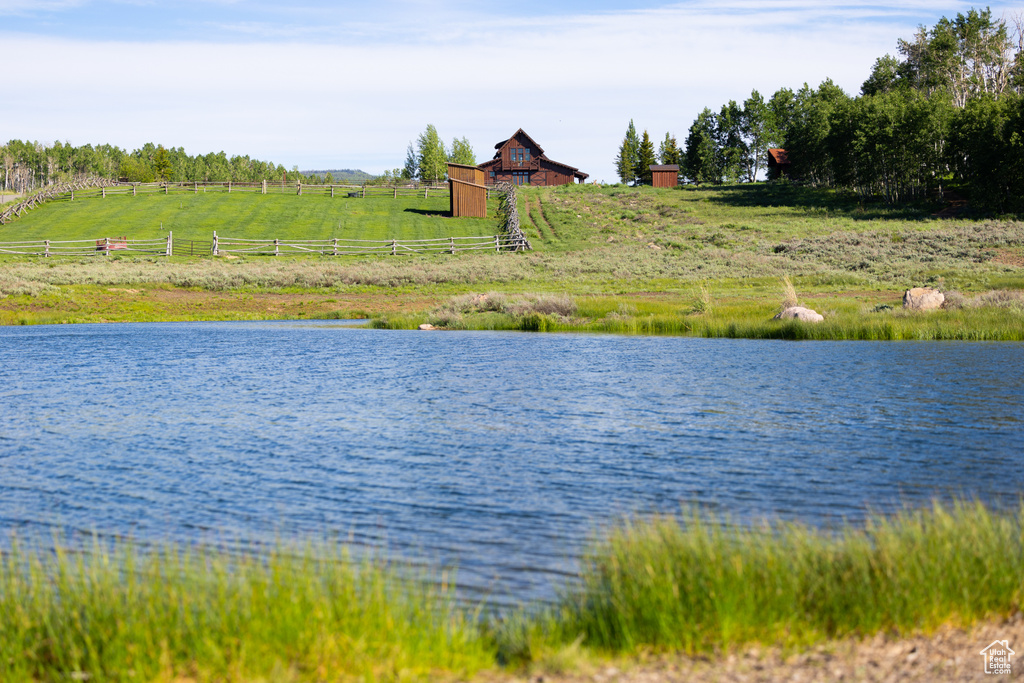 Property view of water with a rural view