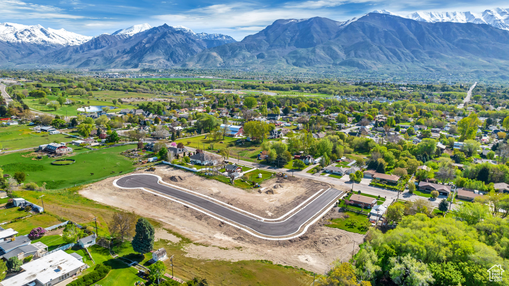 Birds eye view of property with a mountain view