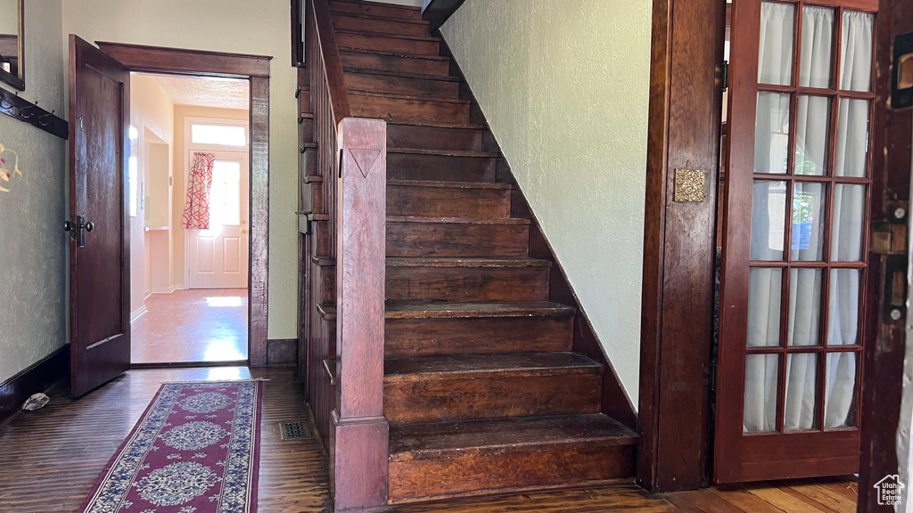 Stairway with hardwood / wood-style floors