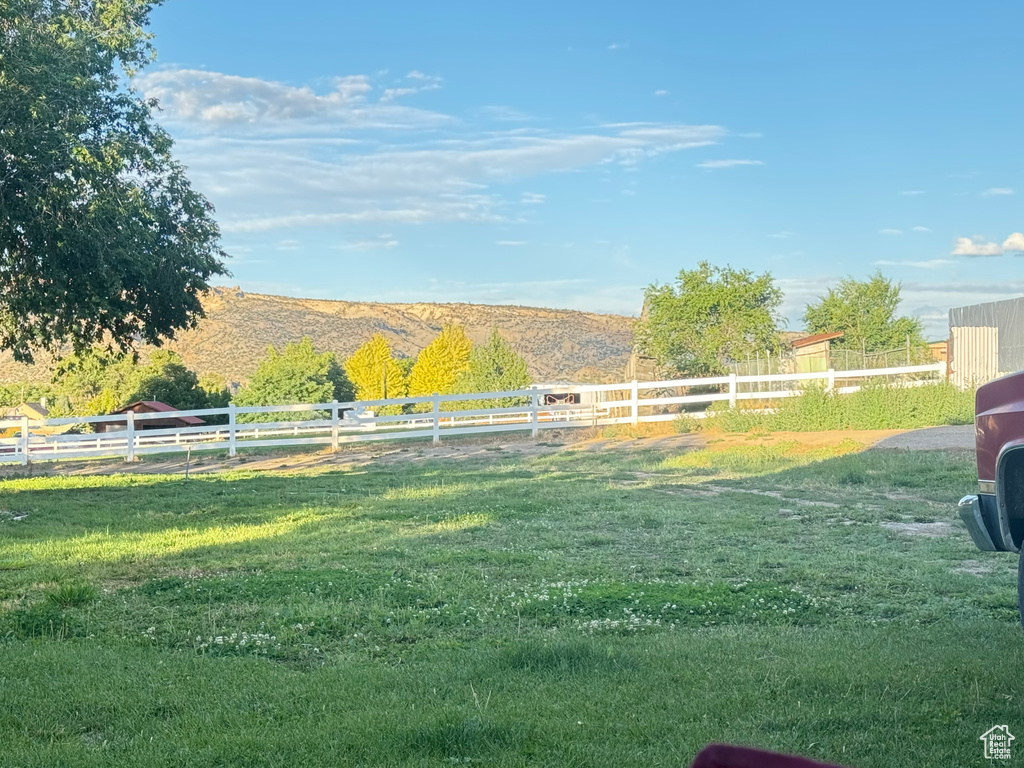 View of yard featuring a mountain view and a rural view