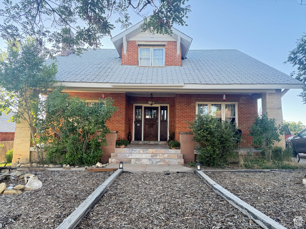 View of front of house with covered porch