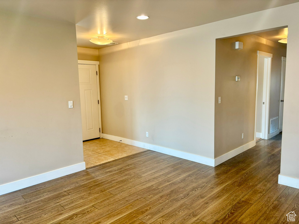 Empty room featuring hardwood / wood-style floors