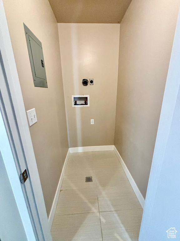 Laundry room with tile flooring, hookup for an electric dryer, and washer hookup