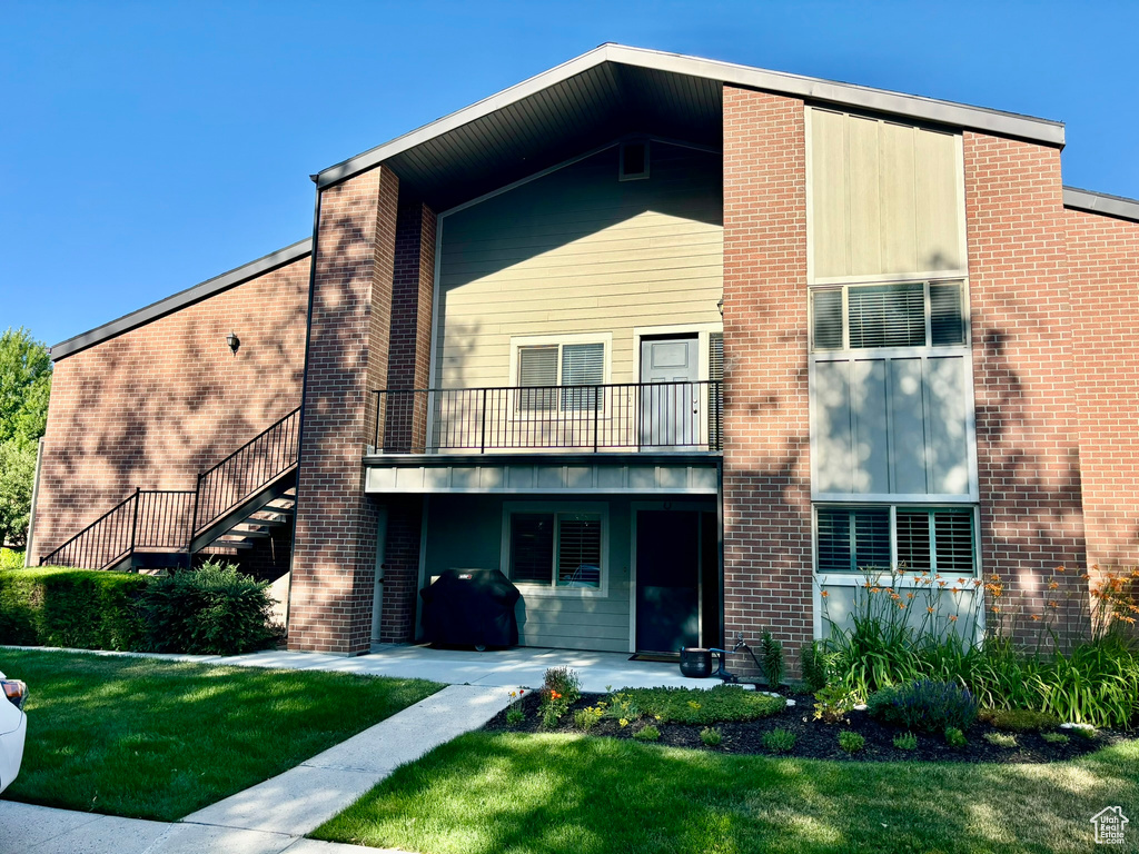 View of front of property with a front lawn