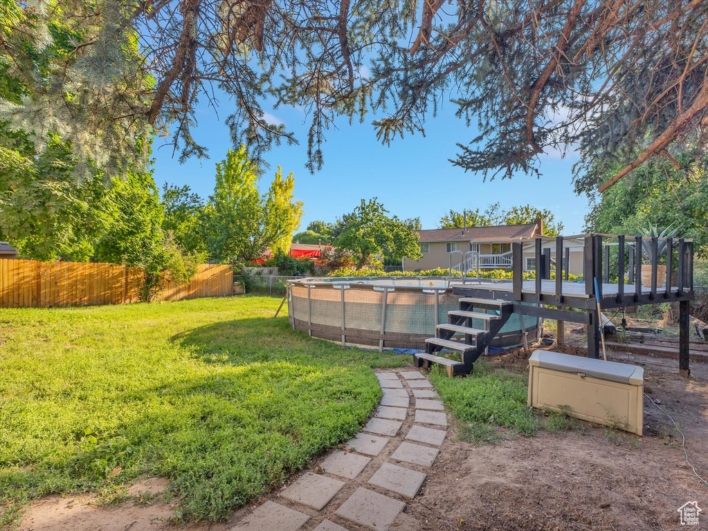 View of yard featuring a fenced in pool